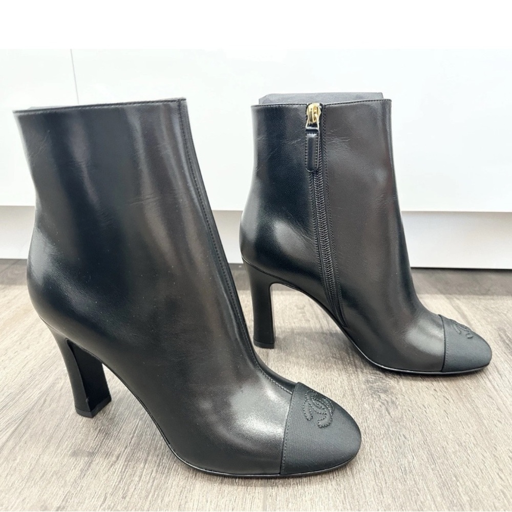 2025 CHANEL BLACK LEATHER ANKLE BOOTS. Size 41C. NEW WITH DUST BAGS
